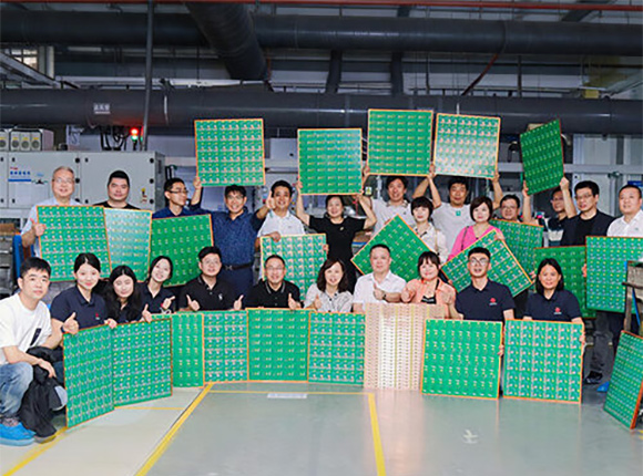 PCBArise manufacturing team with PCB panels for mission and vision